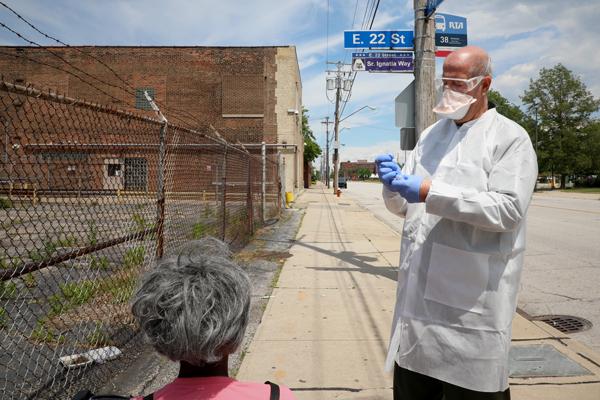 Doctor performing COVID street testing