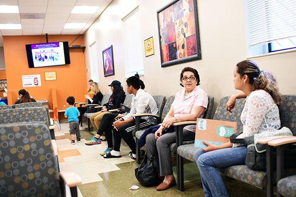 People in waiting room waiting for health care