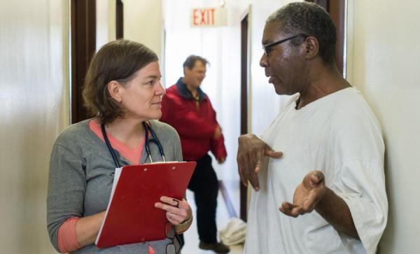 patient and doctor talk in hall