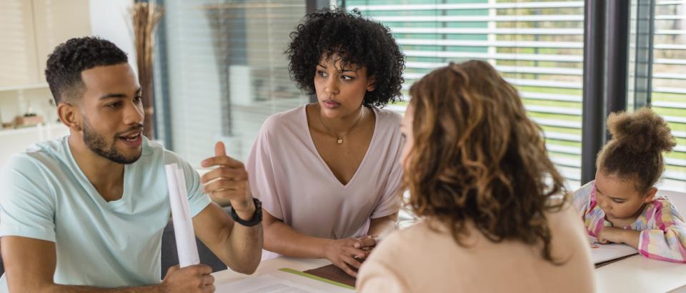Consumer discussing health insurance choices with an agent