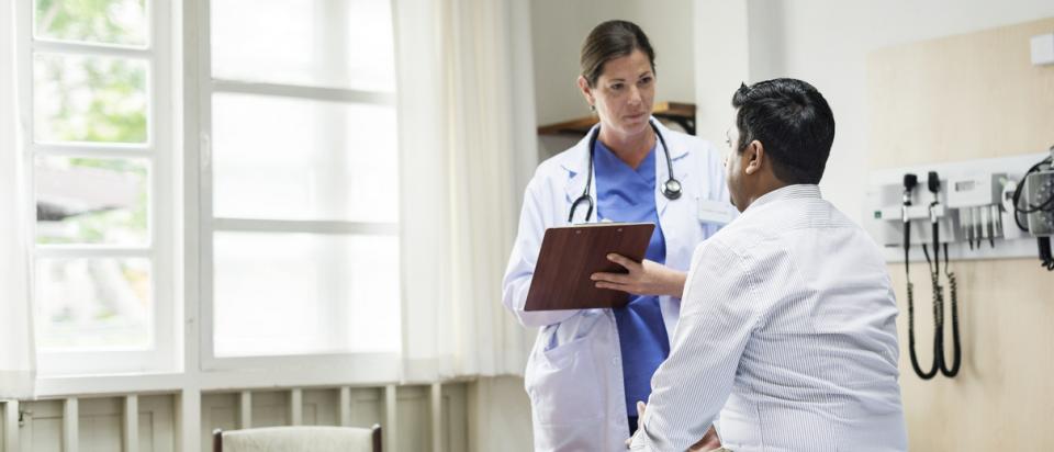 Doctor examines patient covered under Medicaid