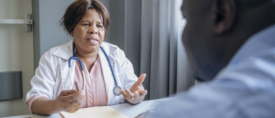 doctor talks to patients about costs