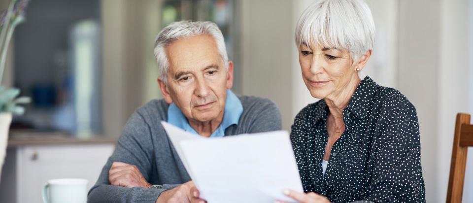 Medicare beneficiaries going over paperwork