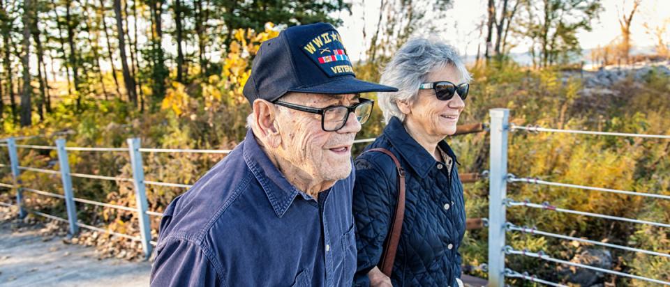 Medicare beneficiary and baby boomer daughter walking