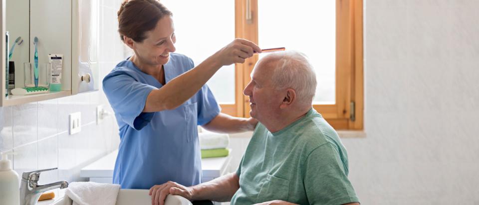 Senior getting help with daily activities