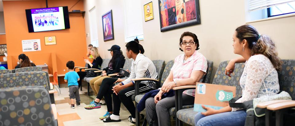 People in waiting room waiting for health care
