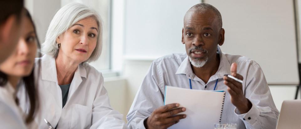 hospital administrator dealing with doctors and bills