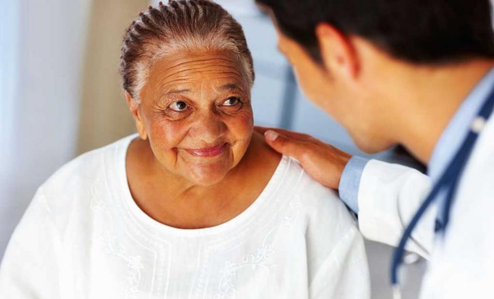 doctor-comforting-woman doctor patient health insurance
