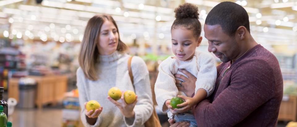 middle-income family shops for groceries