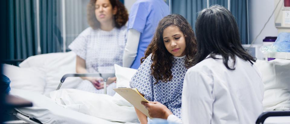 patient in hospital talking to doctor
