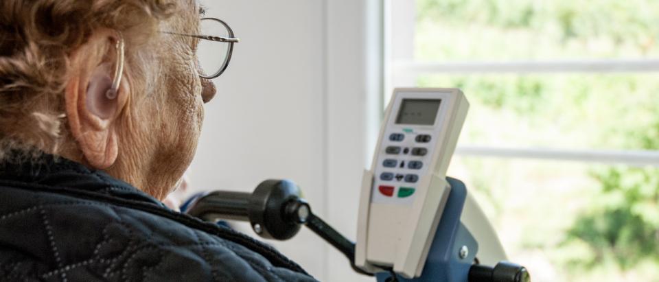 senior Medicare patient with hearing aid