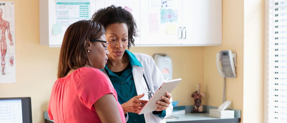 patient talking to doctor about insurance