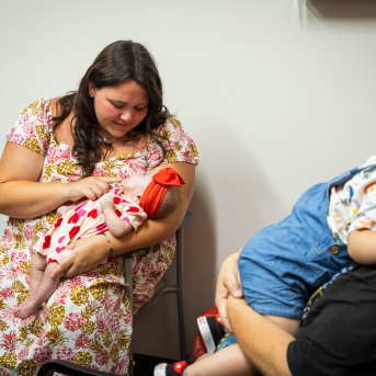 Mom feeds baby in waiting room
