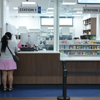 Woman at pharmacy counter