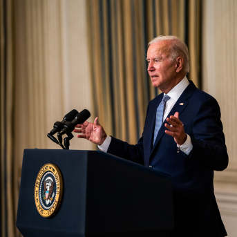 President Joe Biden stands at podium