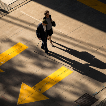 Elderly couple walks on street