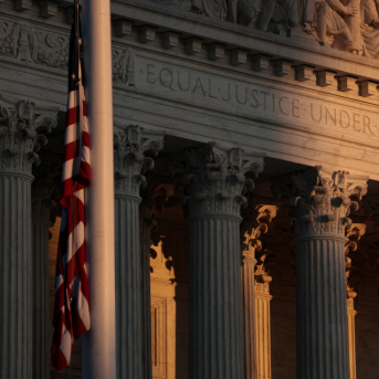 Shadowy image of the American flag in front of the Supreme Court building