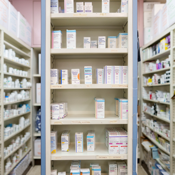 Shelves of pharmacy stocked with medication