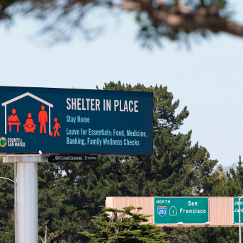 A billboard instructing people to shelter in place is seen along Interstate