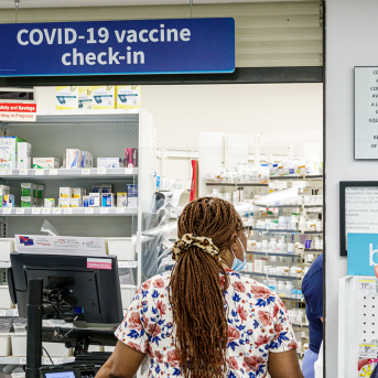 Customer at pharmacy check-in counter
