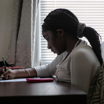 Abigail Previlon, 13, takes part in remote distance learning at home on Oct. 28, 2020, in Stamford, Conn.