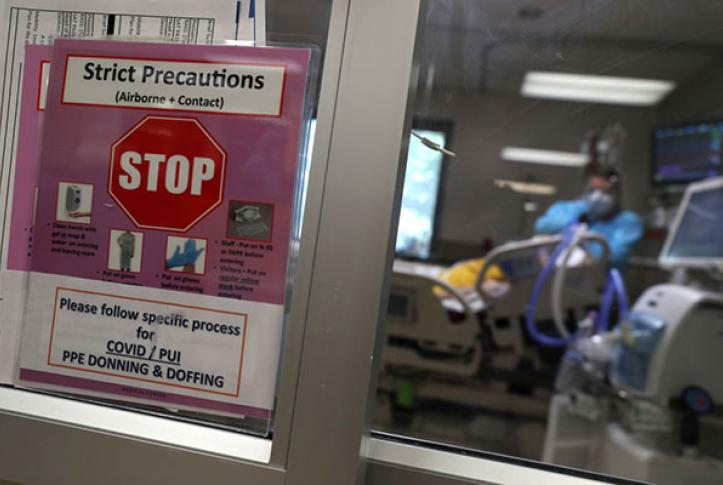 COVID-19 precautions sign in a hospital