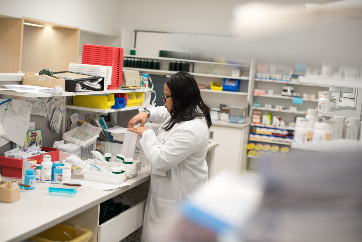 Pharmacy manager Latoya Ross f​ills a prescription order for ​a patient in East​ Cleveland, Ohio. Ohio is one of seven states with a prescription drug affordability board established to rein in drug costs.