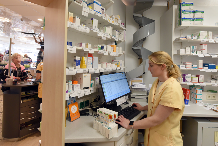 Pharmacy worker at computer