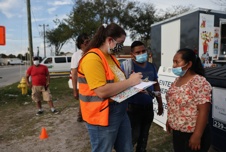 People line up to receive a rapid COVID-19 test among the agricultural community on February 17, 2021, in Immokalee, Florida.