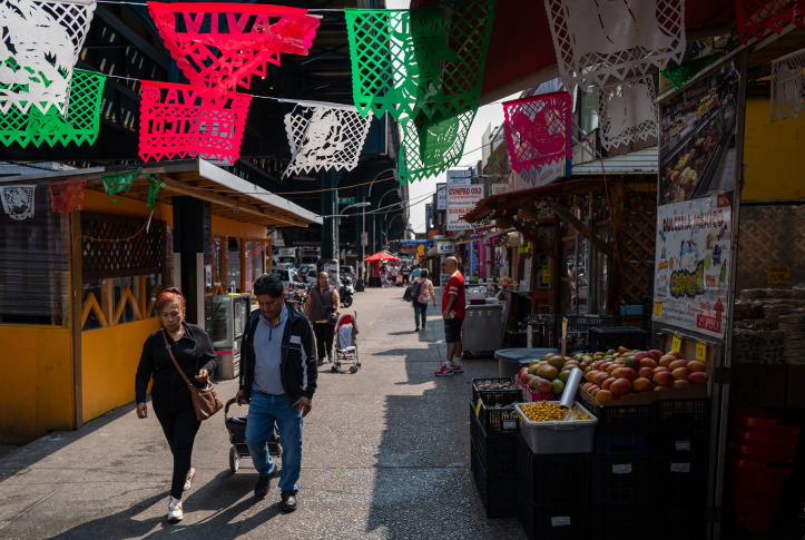 People walking along open market