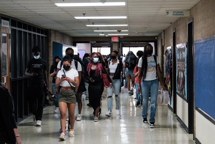 Teens walking in the hallway of Eleanor Roosevelt High School