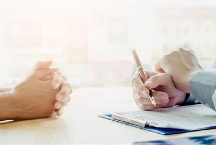 Doctor and patient go over paperwork for insurance marketplace