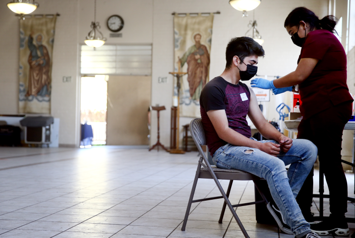 Person receiving COVID-19 vaccine injection