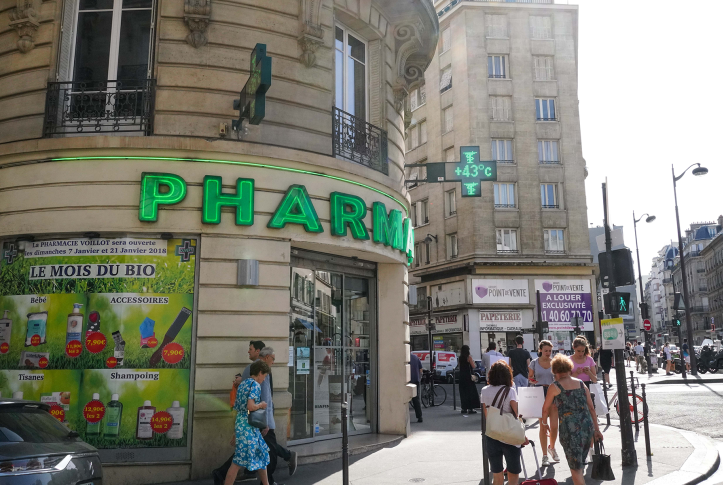 Image, view of pharmacy with people outside