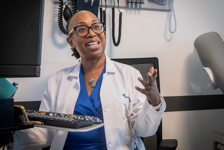 Nurse practitioner talks in doctors chair