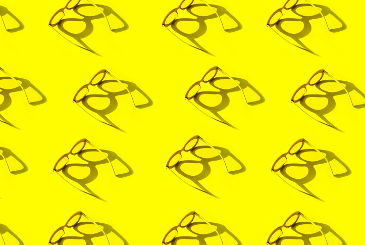 Stylized image of glasses on a yellow background