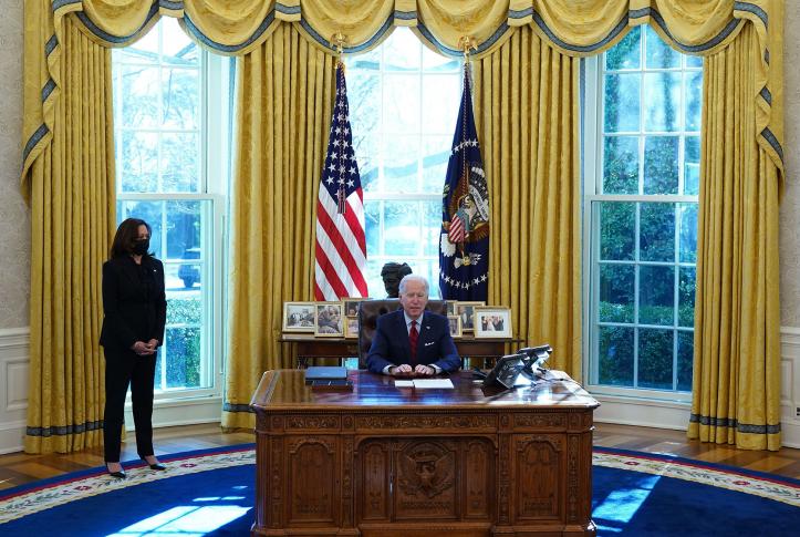 US President Joe Biden, with Vice President Kamala Harris (L), speaks before signing executive orders on health care, at the White House in Washington, DC, on January 28, 2021