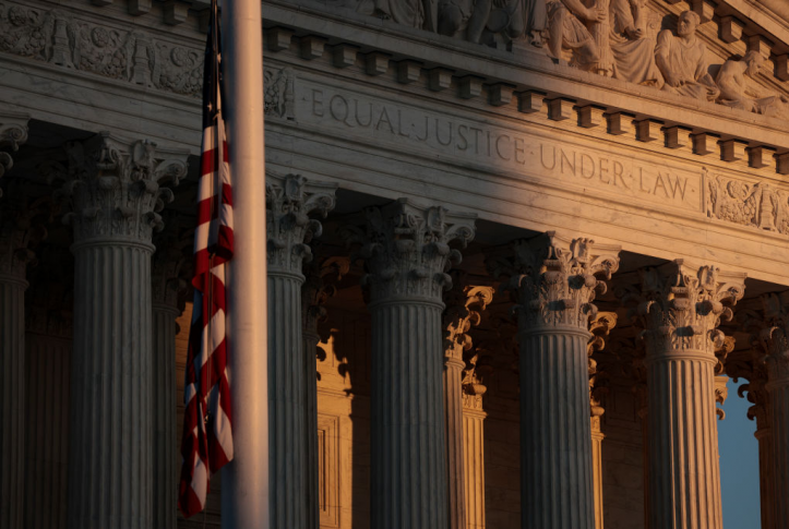 Shadowy image of the American flag in front of the Supreme Court building