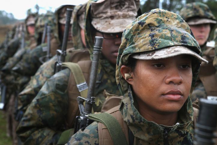 Female service members standing in a line during a training exercise