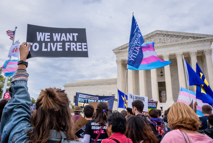 A protester holding a sign outside the U.S. Supreme Court