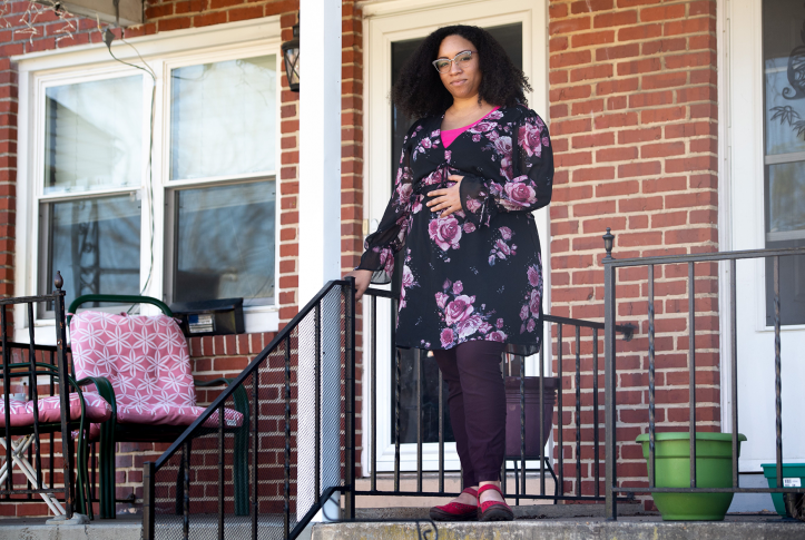 Ashley Esposito, who is pregnant with her first child due in July, stands outside her home in Baltimore, Maryland.