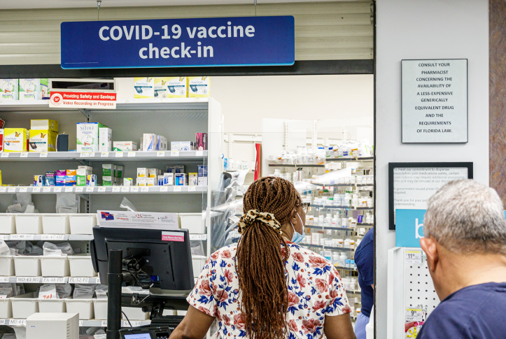 Customer at pharmacy check-in counter