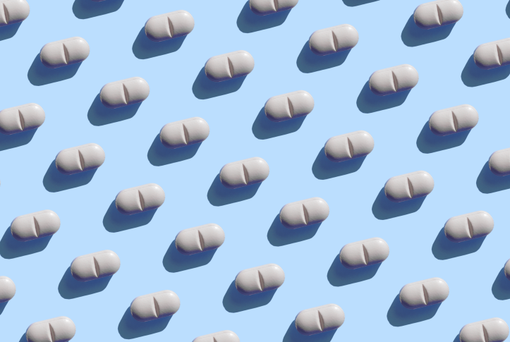 Repeated pills on the blue background