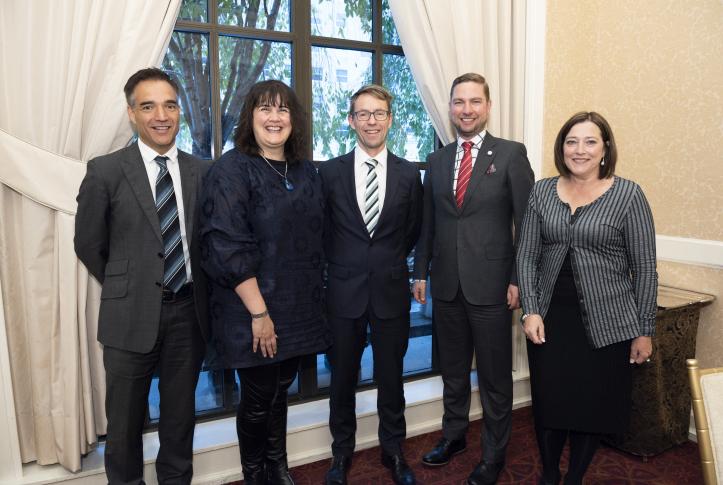 Dr. Ashley Bloomfield, Director-General of Health and Chief Executive of the New Zealand Ministry of Health (center), with fellowship alumni Dale Bramley (2003–04) and Andrew Old (2018–19), as well as colleagues from the Ministry, at the 2018 Commonwealth Fund International Symposium.