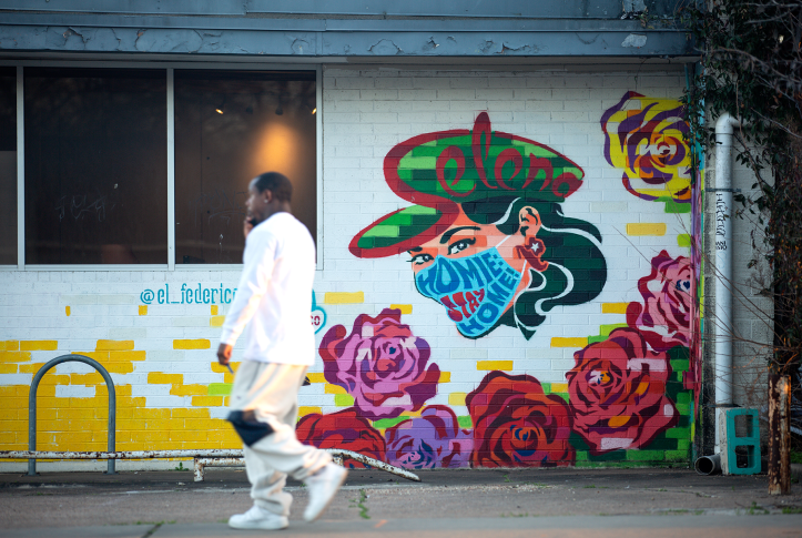 A pedestrian walks down Manor Road on March 3, 2021, in Austin, Texas