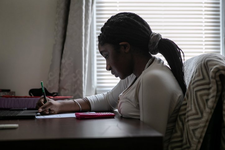 Abigail Previlon, 13, takes part in remote distance learning at home on Oct. 28, 2020, in Stamford, Conn.