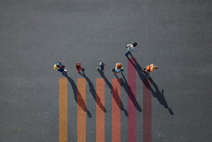 overhead shot of people walking above graphic lines