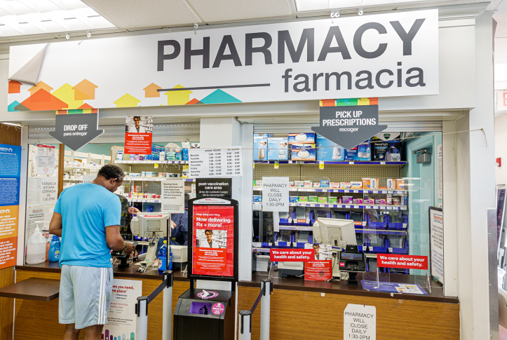 Photo, man at pharmacy counter