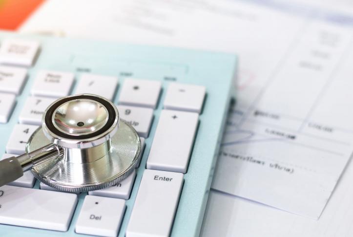 Stethoscope on top of a calculator