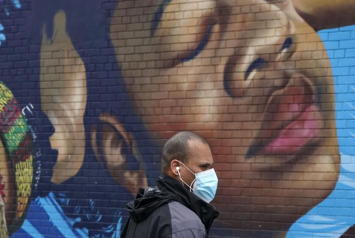 Black man wearing mask in the Bronx during the COVID-19 pandemic